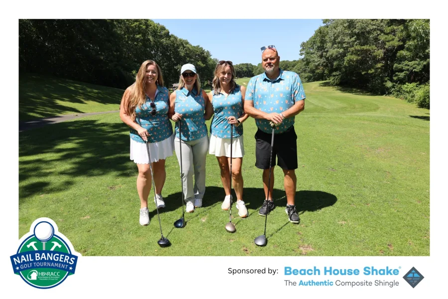 A printed event photo of a golf foursome with a custom sponsor branding strip along the bottom