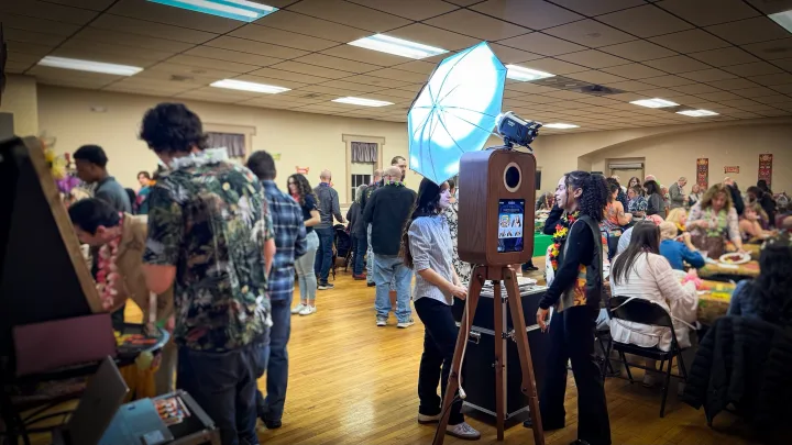 Guests gathered around the Flashback booth at a packed event