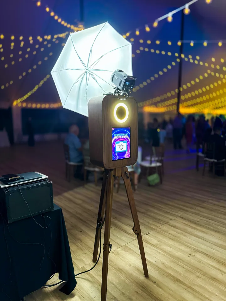 Flashback booth on a tent dance floor lit by festoon lights