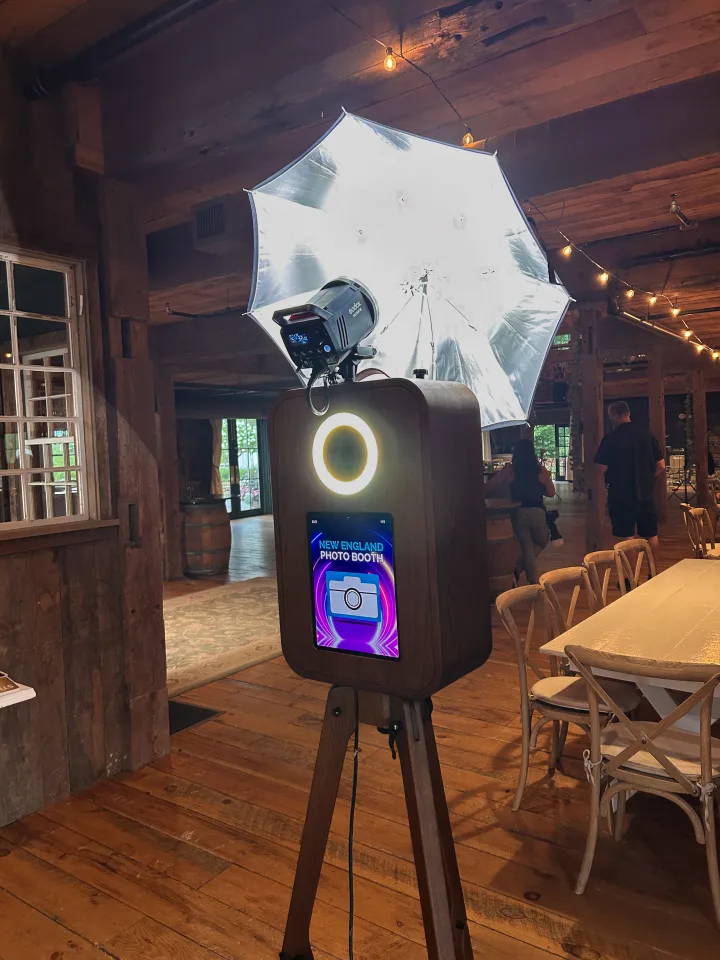 Flashback booth with studio umbrella inside a rustic barn venue