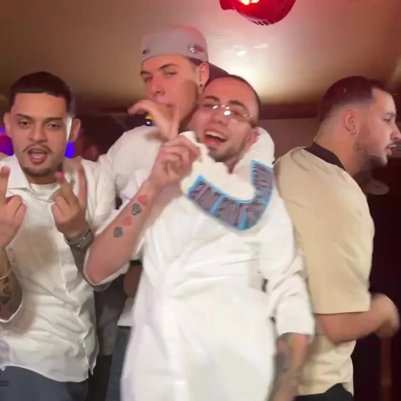 A group of guests crowding onto the platform, shot by the booth camera