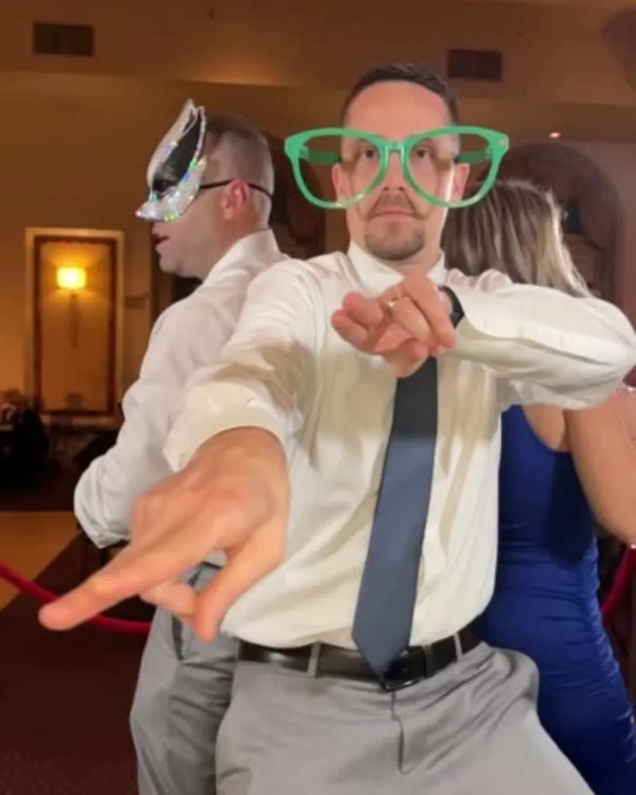 A guest in oversized novelty glasses caught mid-pose by the 360 booth's own camera