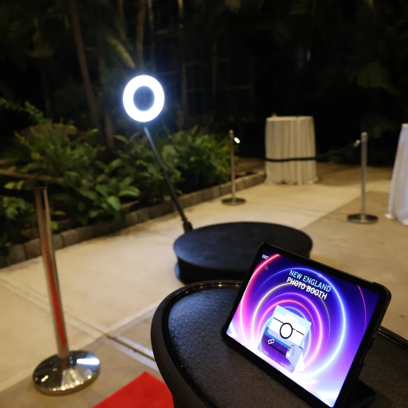 The 360 booth and its lit sharing station at an outdoor evening event