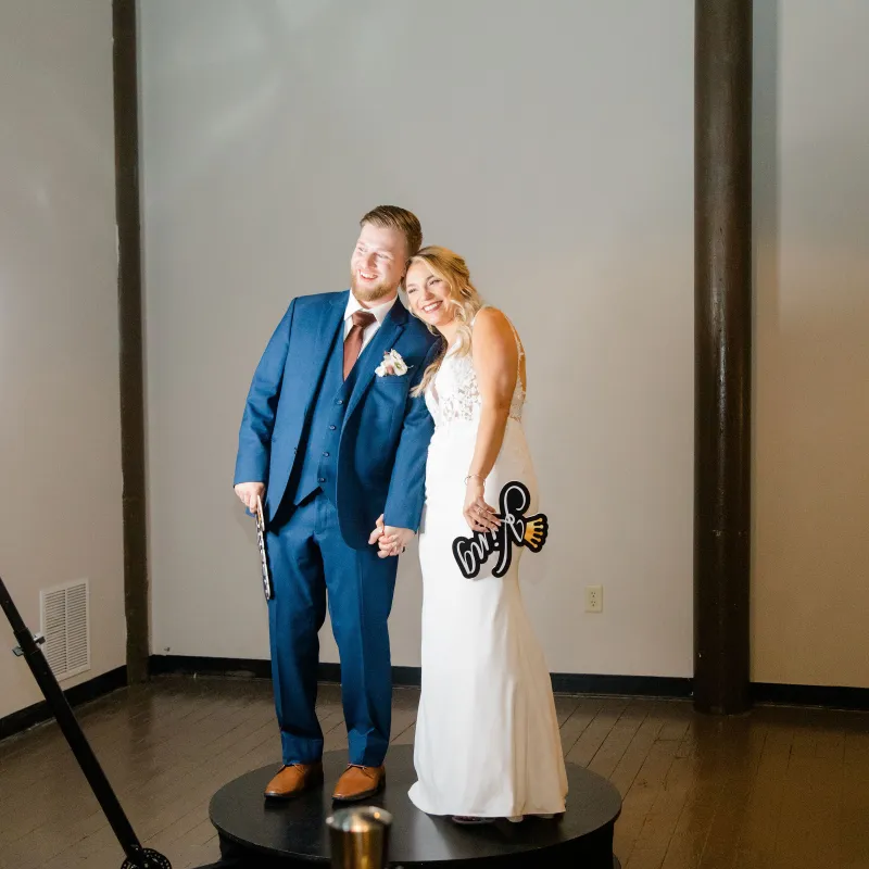 Bride and groom together on the 360 booth platform at their wedding