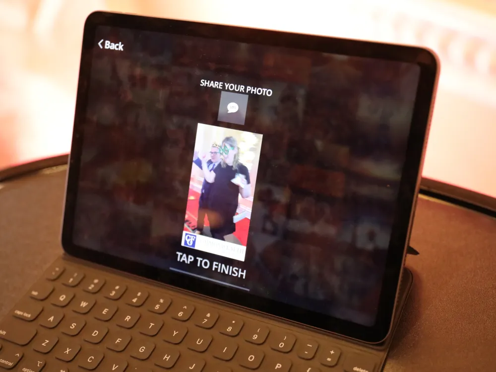 The 360 booth sharing station tablet showing a guest's clip ready to text or email