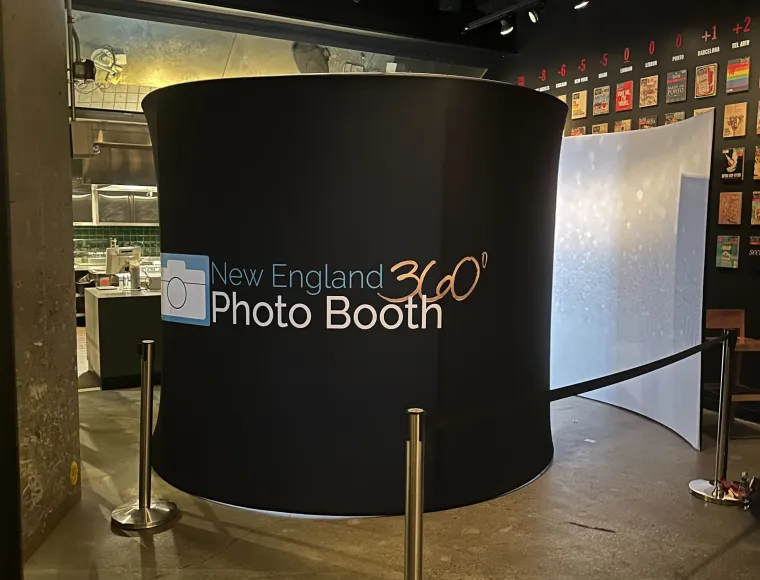 360 booth surround set up in a restaurant venue with a gallery wall