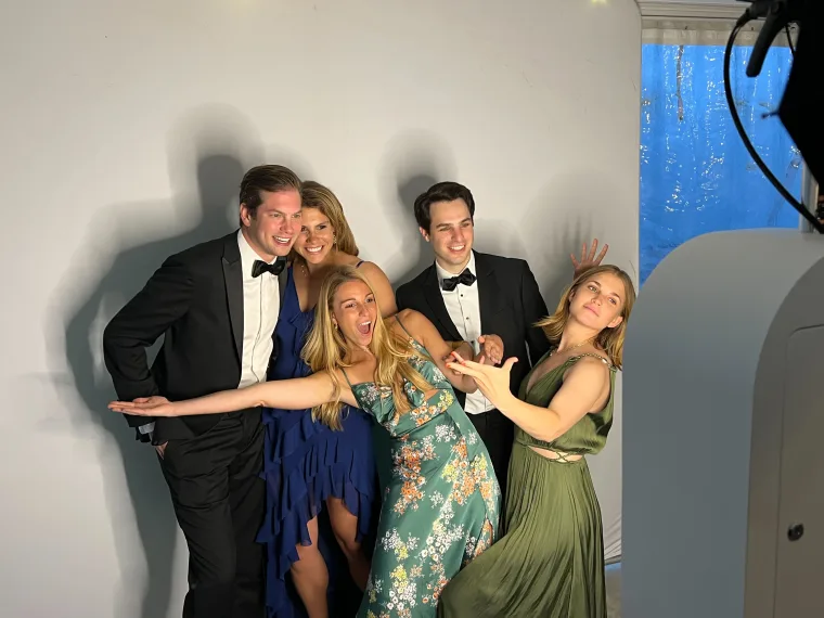 Bridal party in black tie posing with the LuxPod photo booth