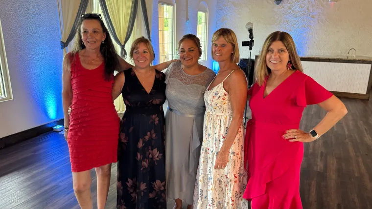 Bridesmaids posing together at a wedding reception
