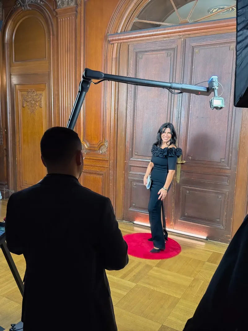 The GlamBot robot arm filming a guest on the red carpet