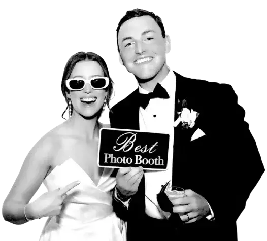 Couple posing with props in a glam photo booth