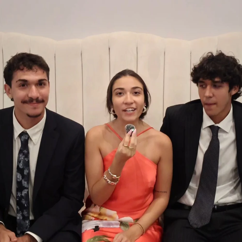 Three wedding guests recording a Confessional Booth message together