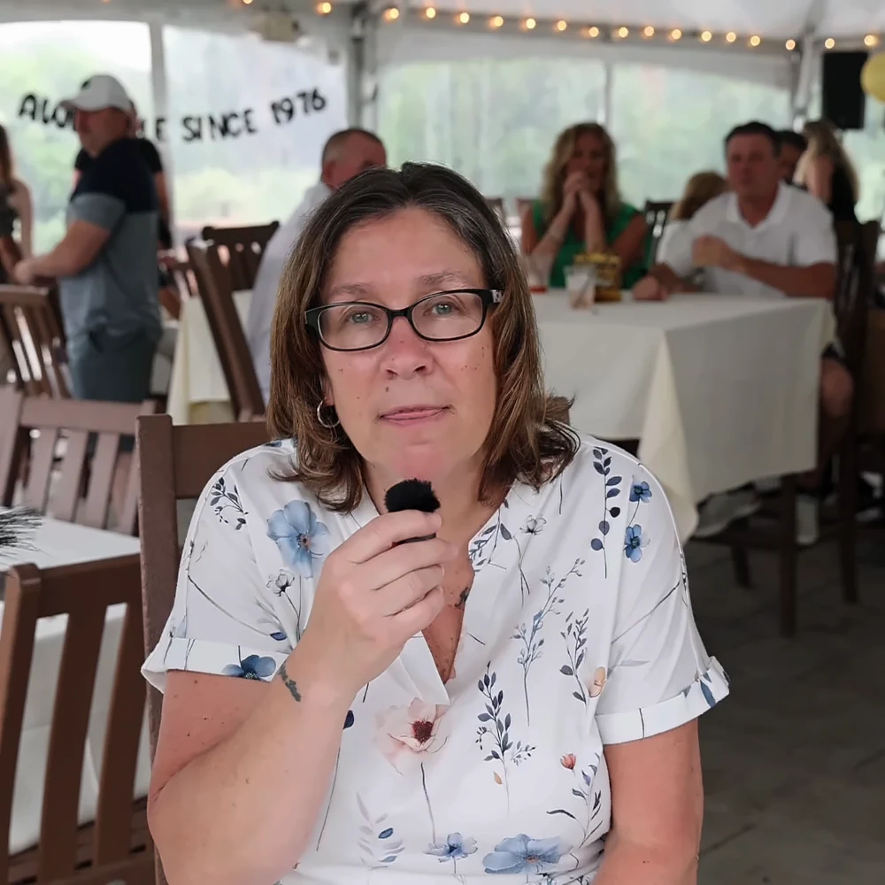 Guest sharing a heartfelt video message into the mini mic