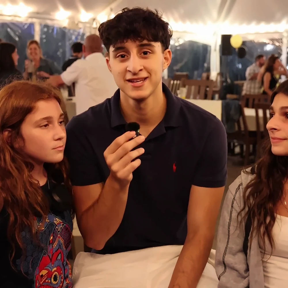 Younger guests recording a Confessional Booth message together
