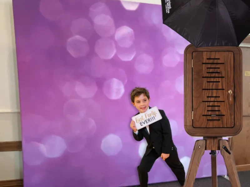 Flashback booth at a wedding reception with guests posing
