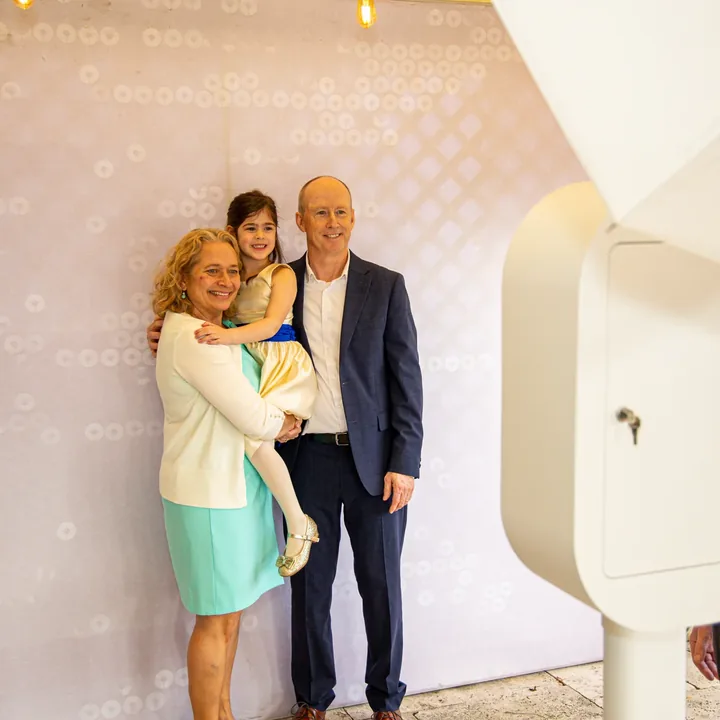 Family posing together at LuxPod photo booth