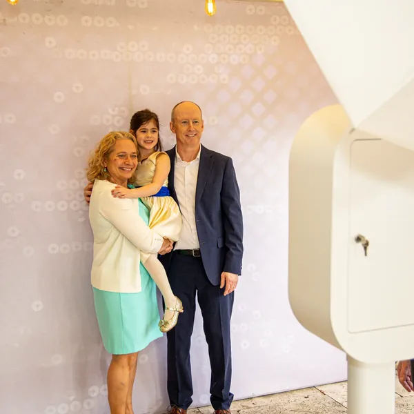 Family posing in the LuxPod photo booth