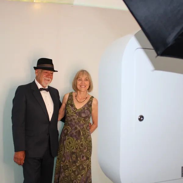 Wedding couple smiling at LuxPod photo booth