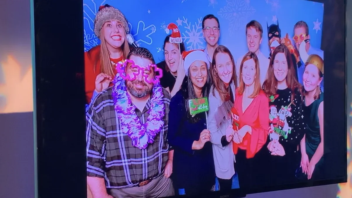 Live onsite TV slideshow displaying photo booth media at an event