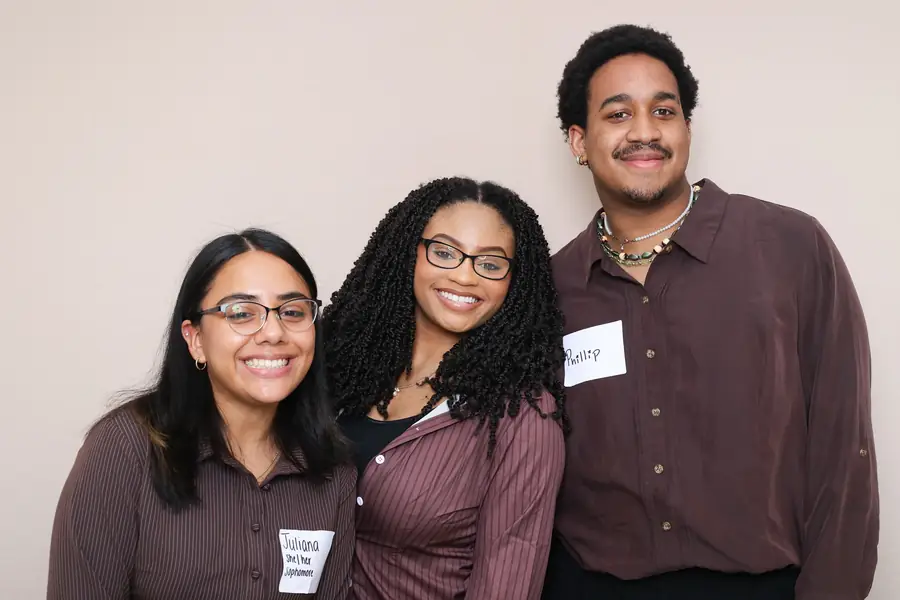 Three colleagues in the photo booth at a corporate networking event