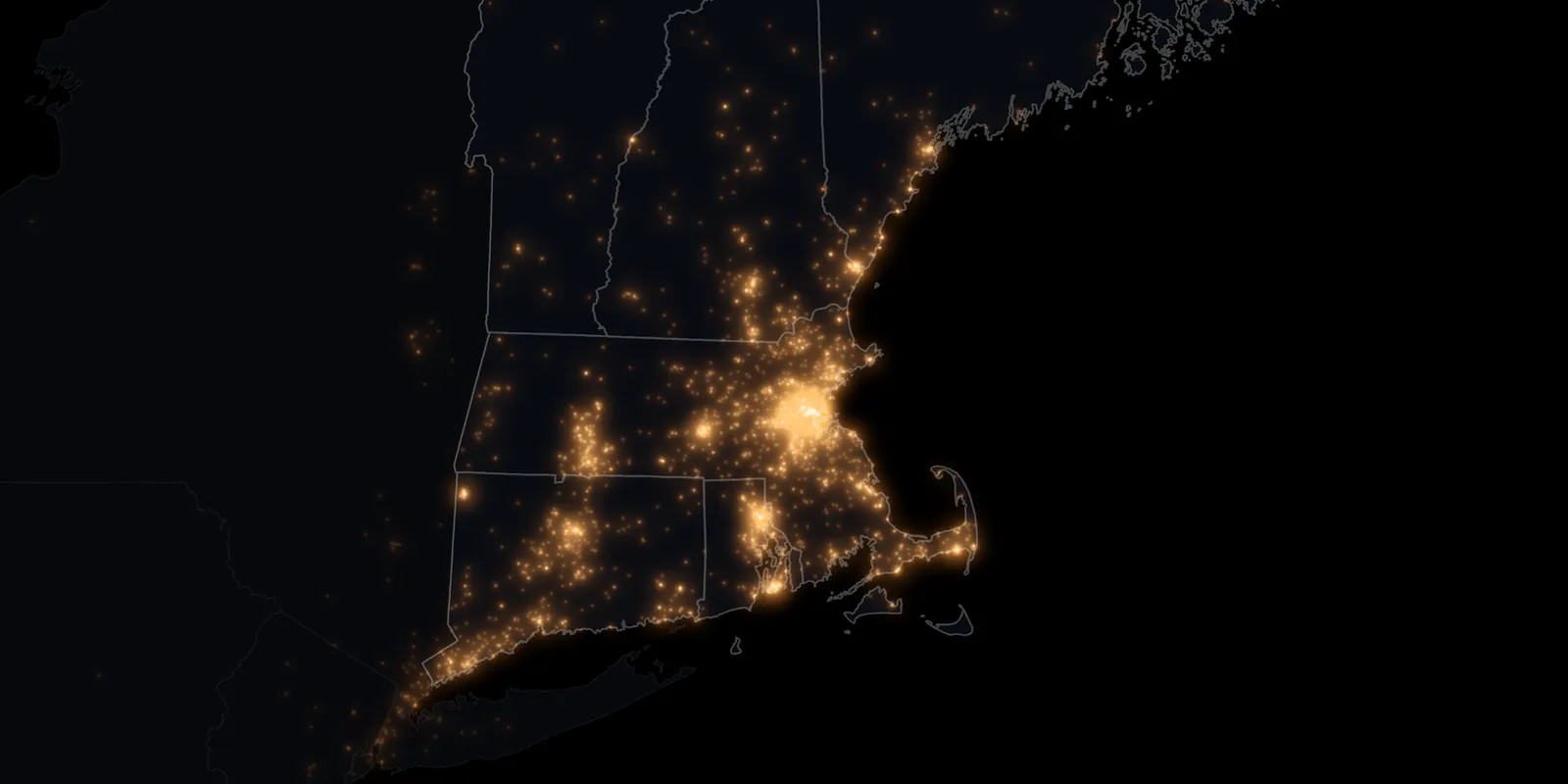 Night map of New England with a warm light for every event we have worked, brightest around Boston